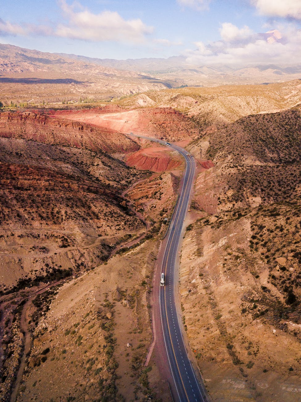 road passing through mountain terrain